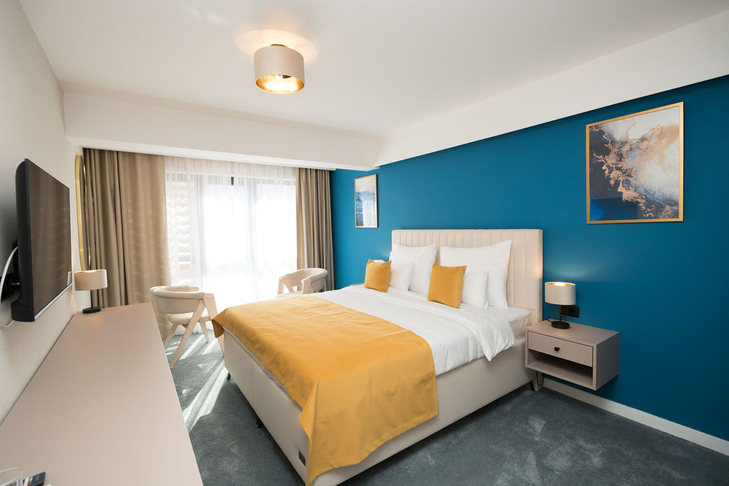 King room with curtain-draped window