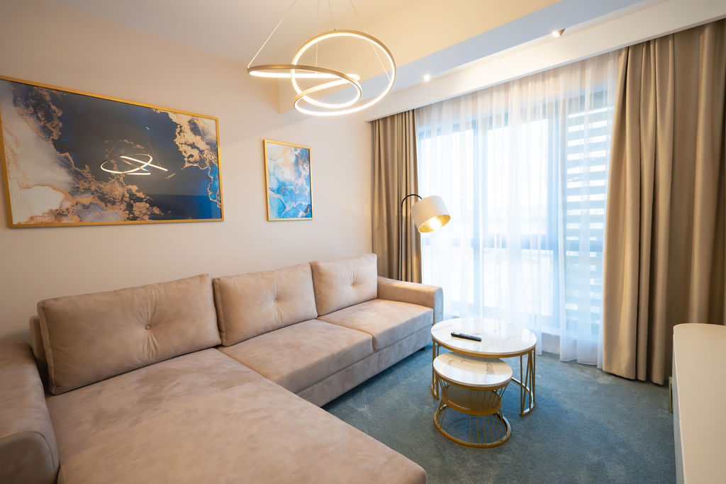 Suite lounge with sculptural pendant light